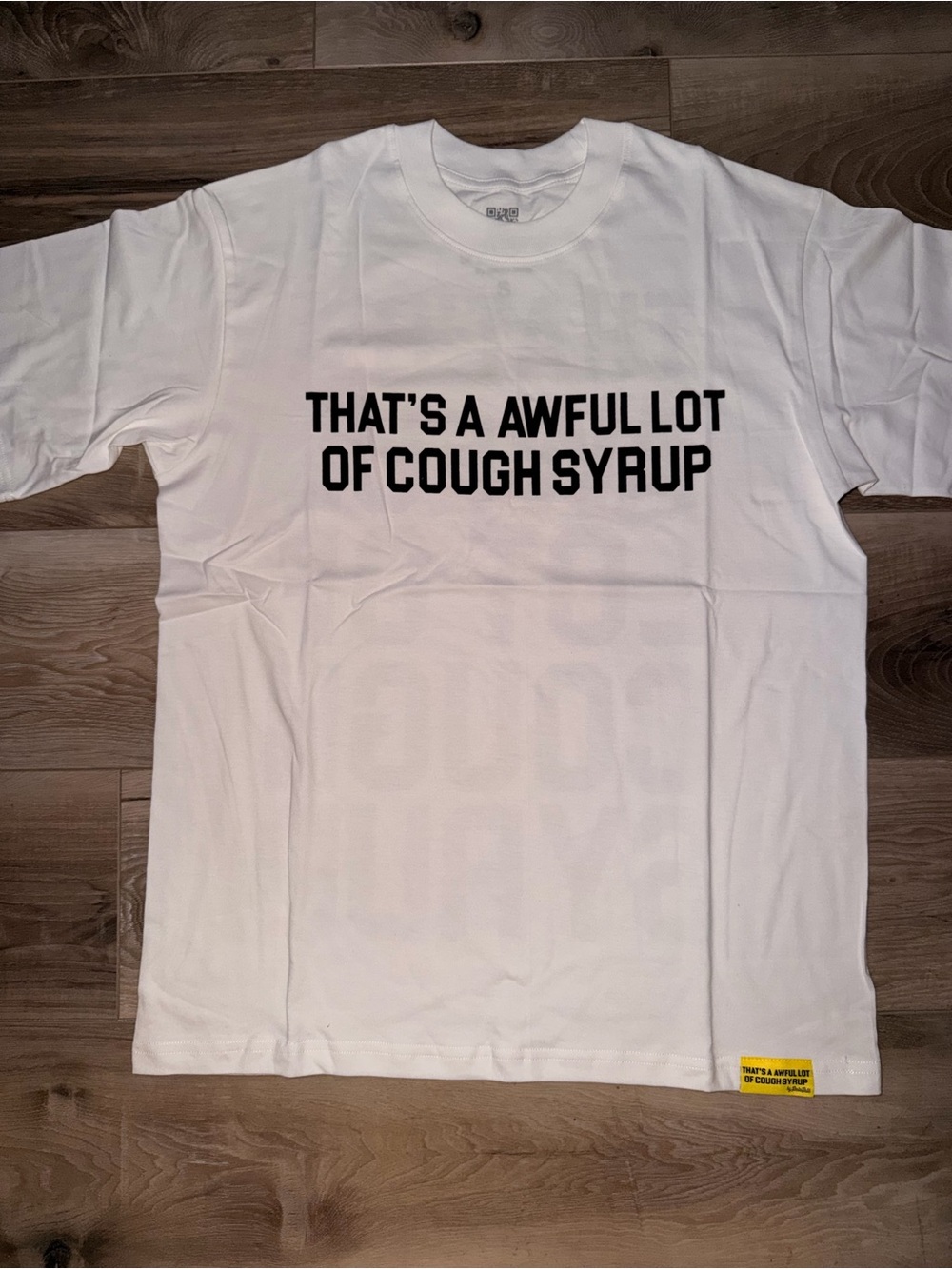 White Short-Sleeve Graphic Tee with Bold Black Text